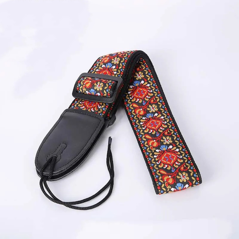 Sangle en tissu avec un motif floral brodé rouge