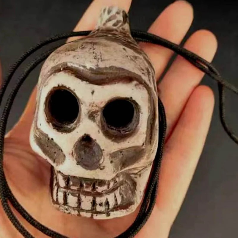 magnífico Ocarina Cráneo Humano Silbato de la Risa Macabra