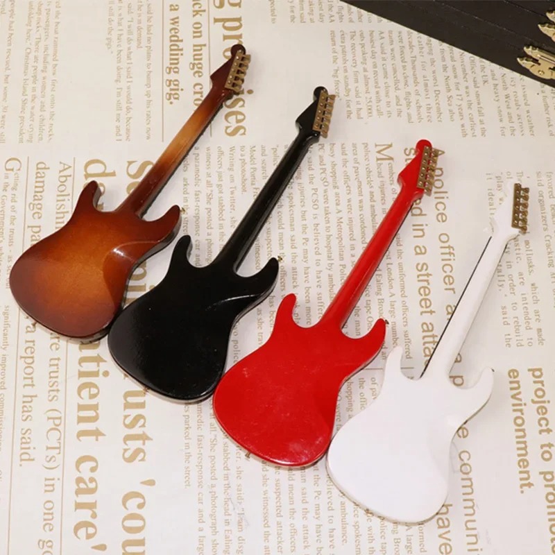 Parte trasera de una guitarra eléctrica miniatura en rojo o negro con caja de almacenamiento - 4 tai
