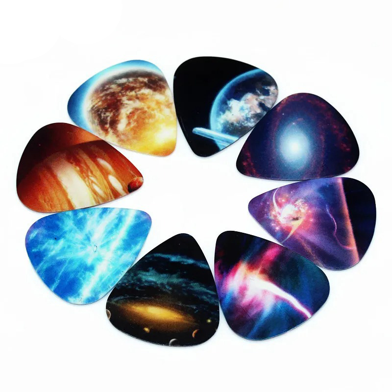 Set di 10 plettri con motivi Universo, Spazio, Pianeta e stelle