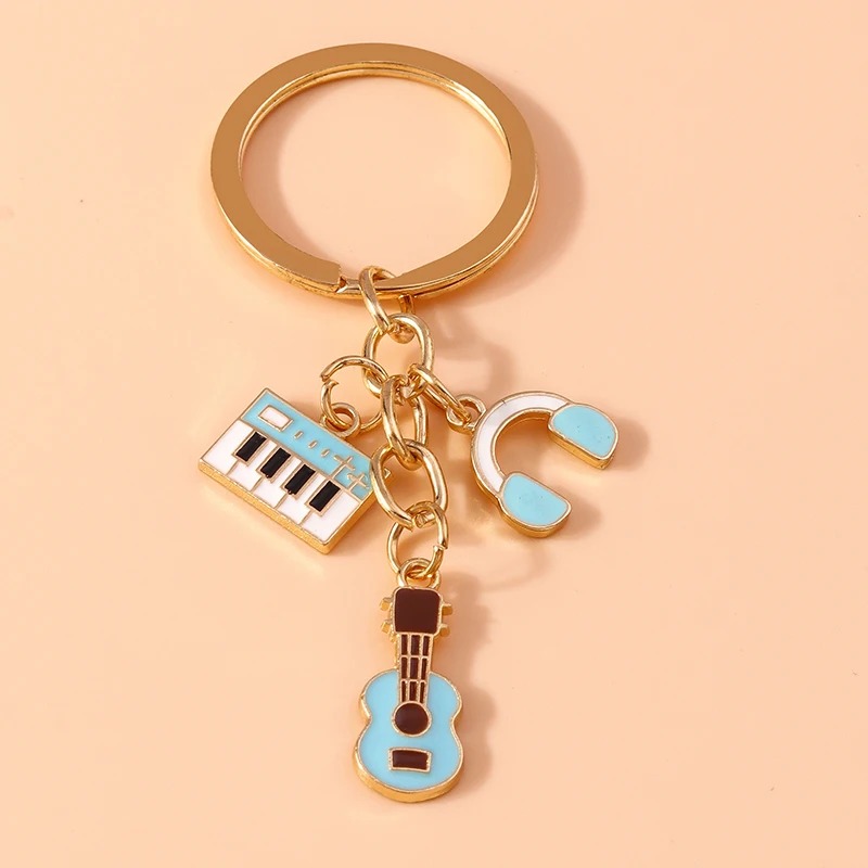 Portachiavi a forma di chitarra e strumenti musicali in metallo di colore blu