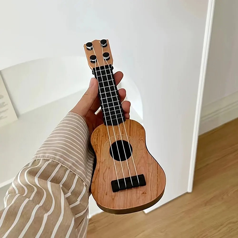 Vista detallada de Mini Guitarra Ukulele para Niños - Ukulele Clásico de Madera Natural